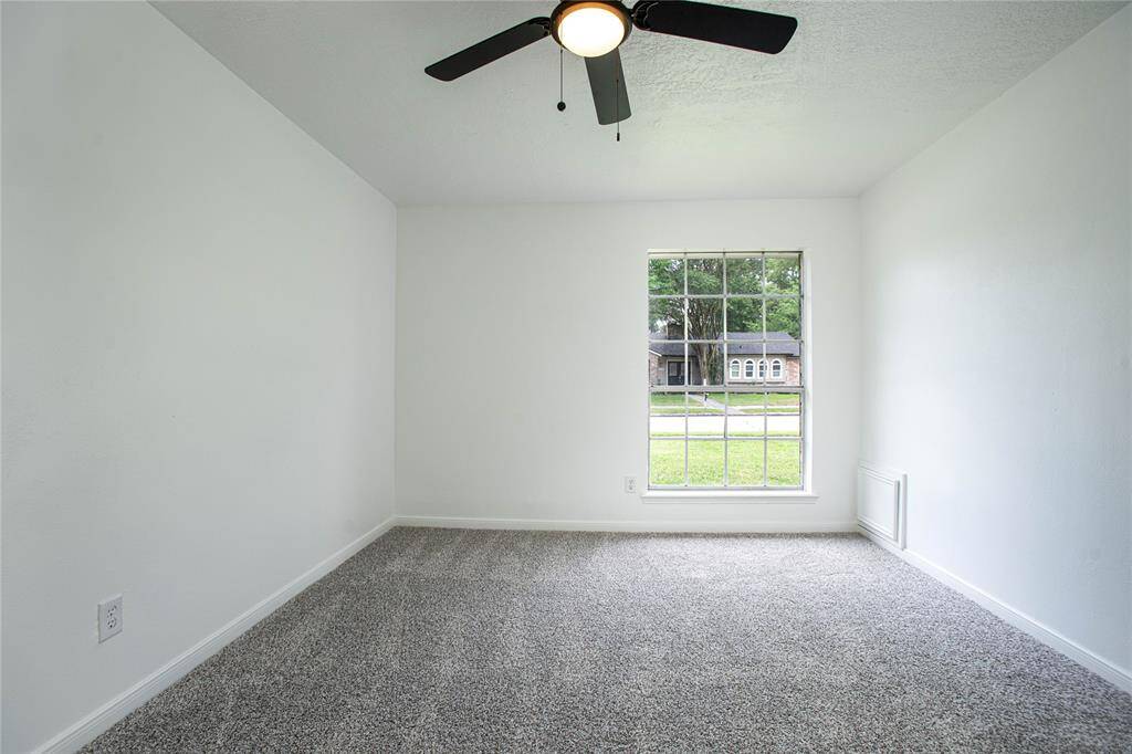 Secondary bedroom with plenty of natural lighting, new carpet and new hardware!
