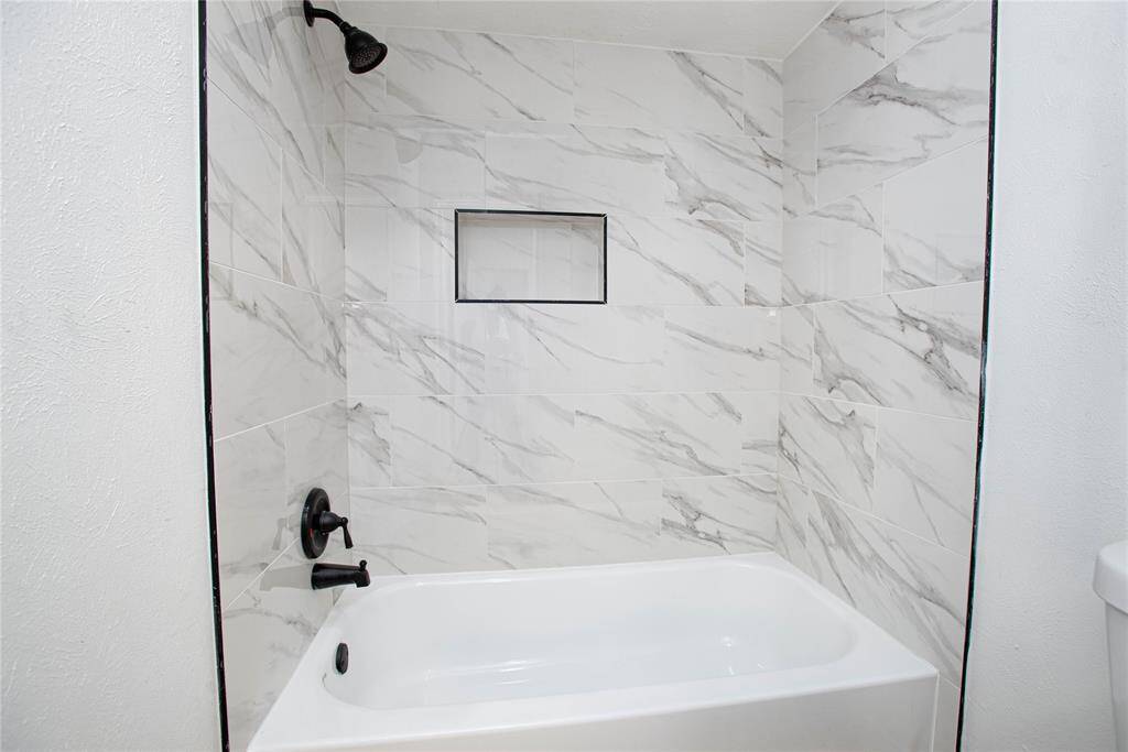 Secondary restroom that was fully renovated with new tile!