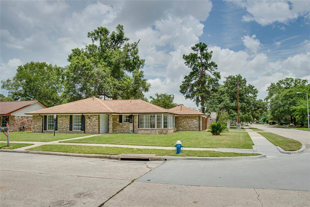 A look at the whole corner lot that has beautiful curb appeal!