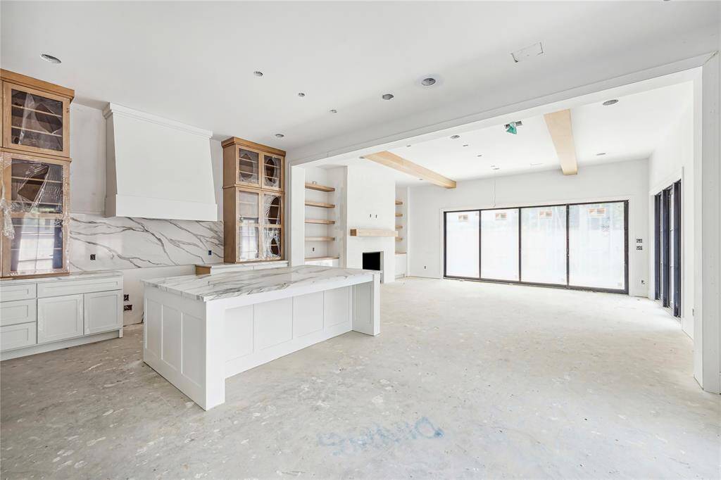 First floor includes main living space, with dining right off the spacious kitchen, both flowing seamlessly into the living room.