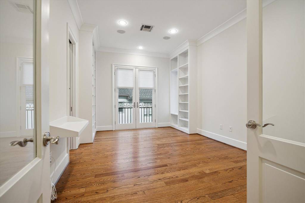 Another view of the study with great French doors with a Juliet balcony.