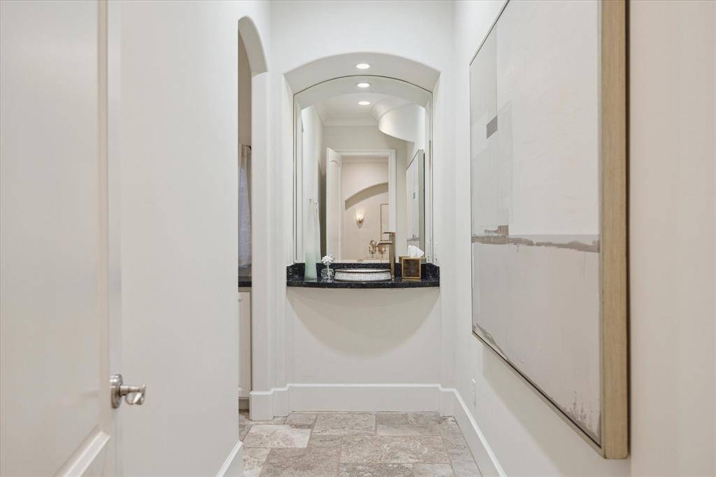 A chic powder room featuring sleek, elegant finishes.