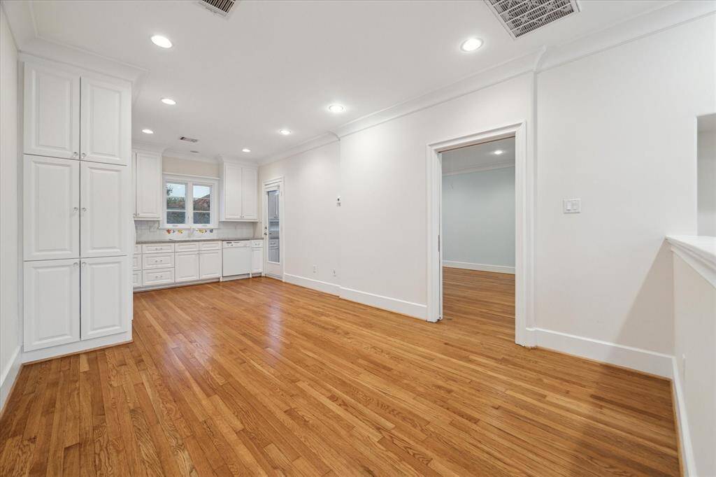 The separate garage apartment featuring a kitchen, living area, bedroom, bath, and a private balcony.