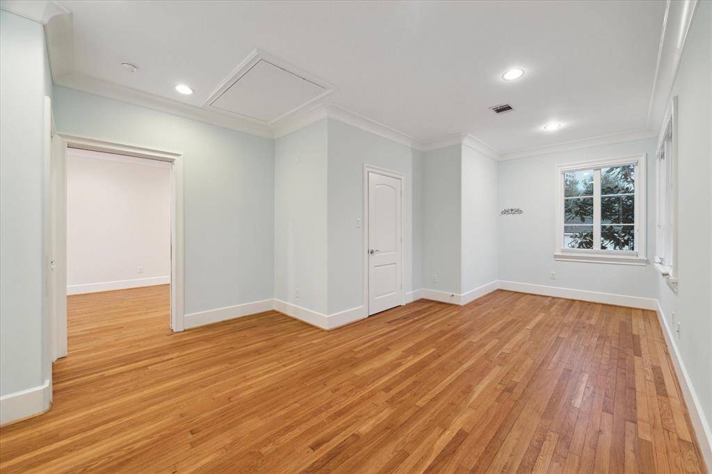 The garage apartment bedroom featuring a spacious closet and a private en-suite bathroom.