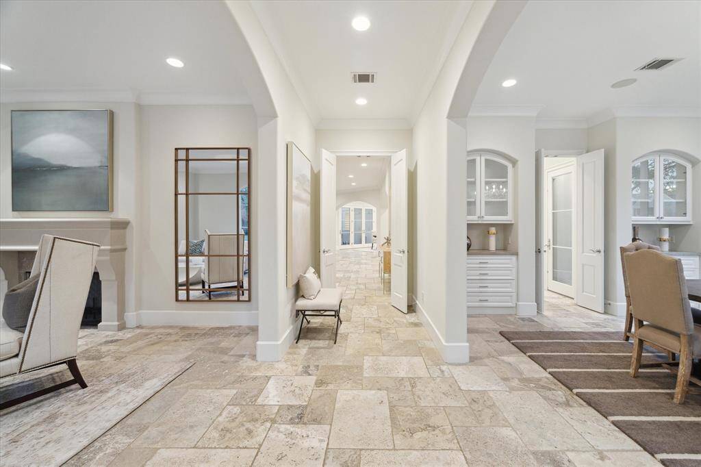 The entry hallway is flanked by the formal dining and living room.