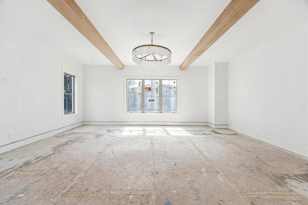 On the second floor you can find Primary suite. 10-foot ceilings, 10" White Oak beams and chandelier greet you as you enter.