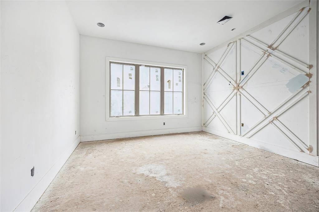 As you reach the second floor you are greated by this landing area with large windows and feature wall.