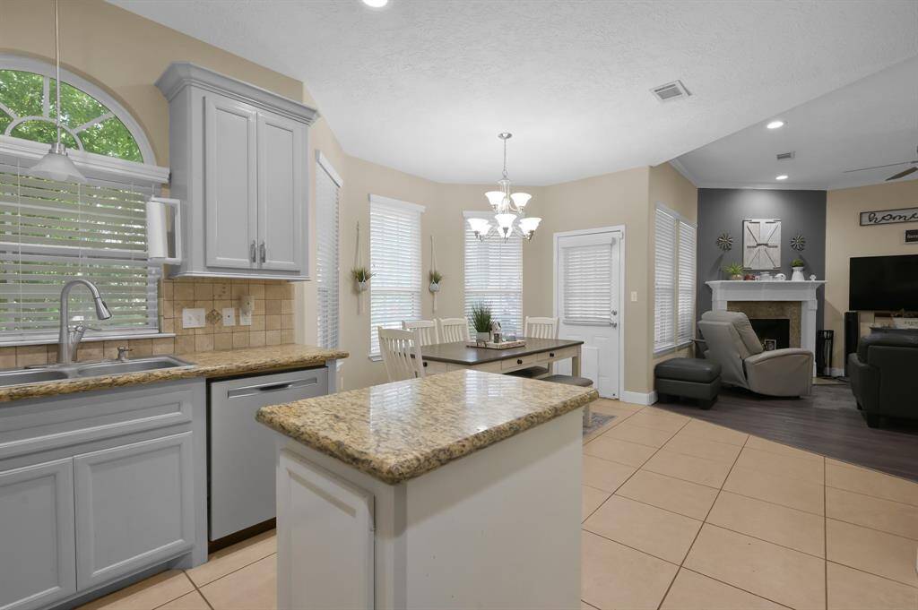 Granite counter tops & island for additional storage.