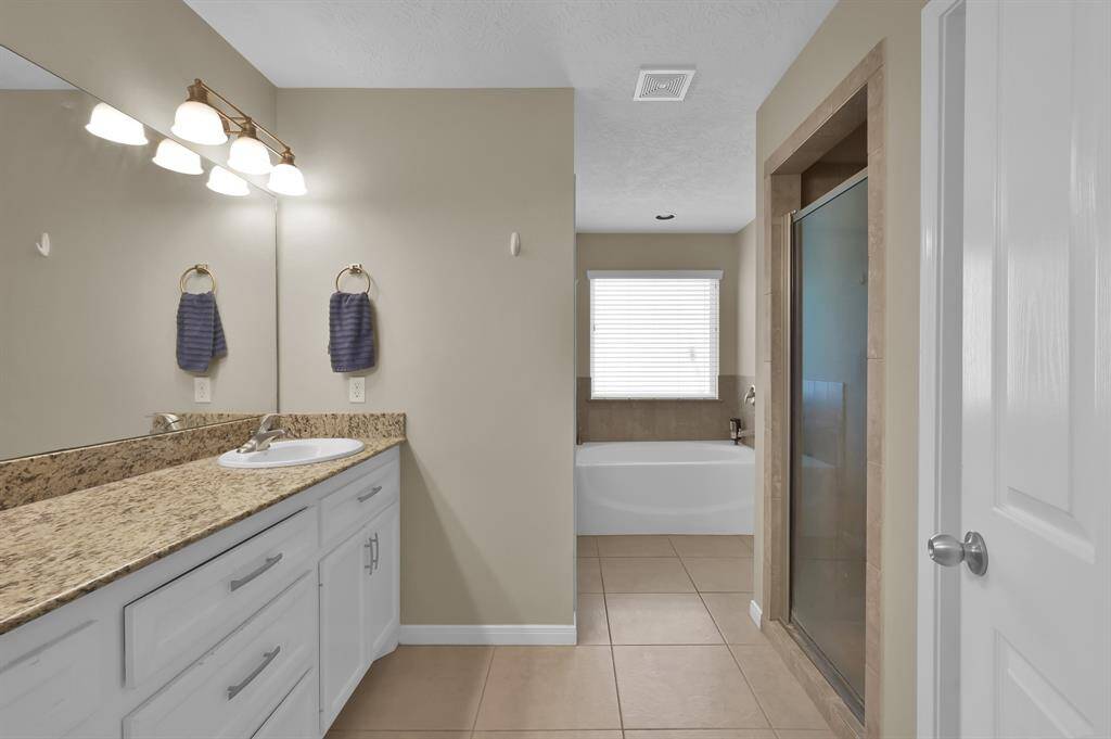 Primary bath with separate tub & shower.