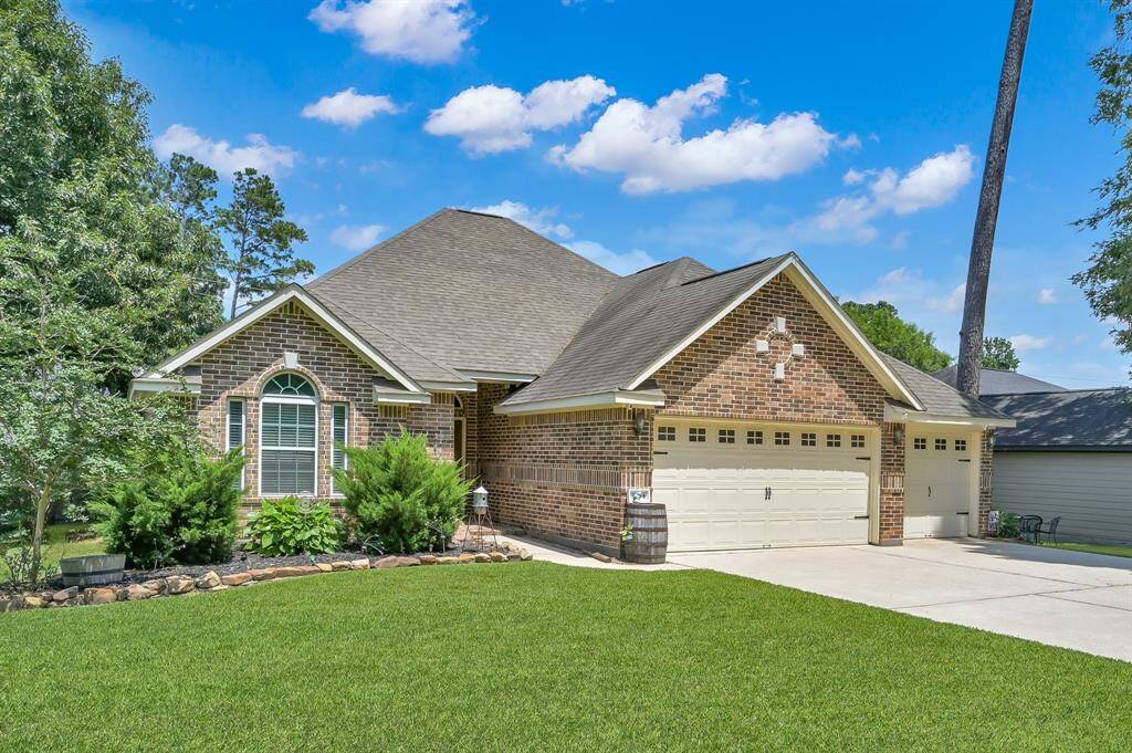 Mature landscaping & oversized driveway.