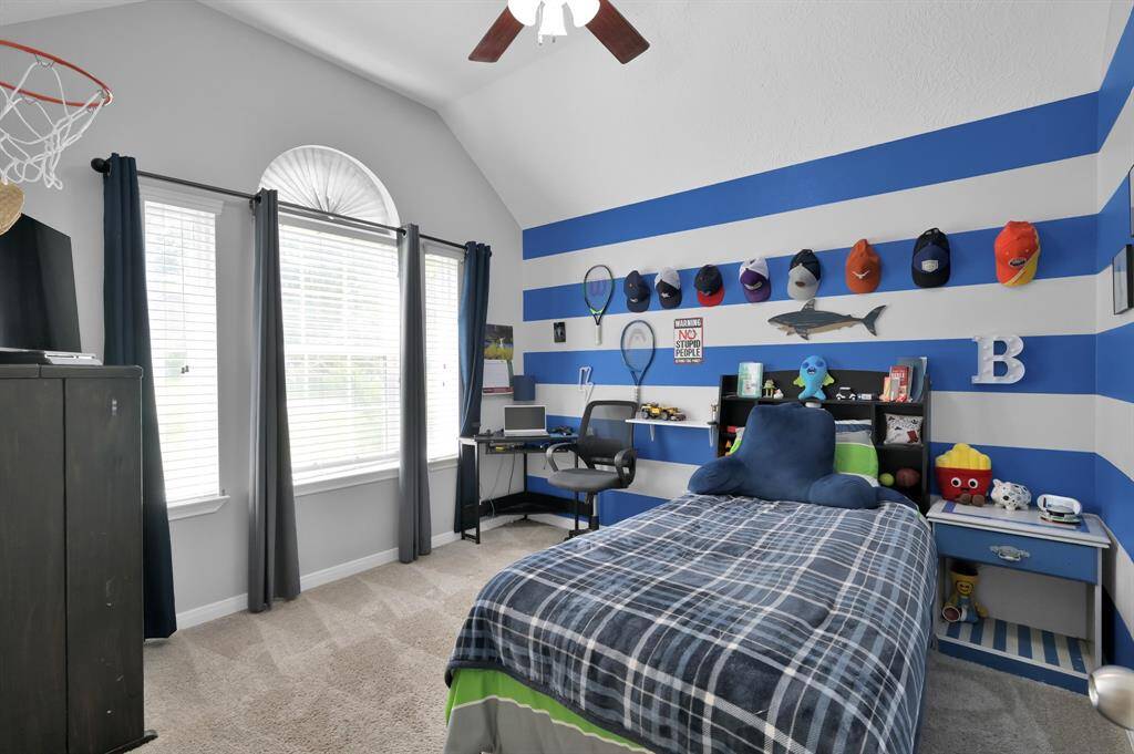 Bright and inviting third bedroom with abundant natural light.