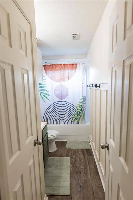 Full bathroom upstairs with custom wainscoting.