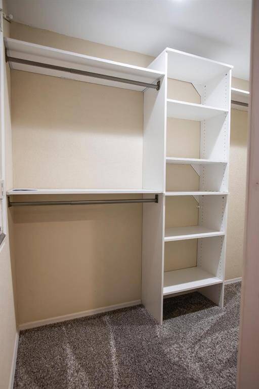 HUGE walk-in closet with custom built ins.