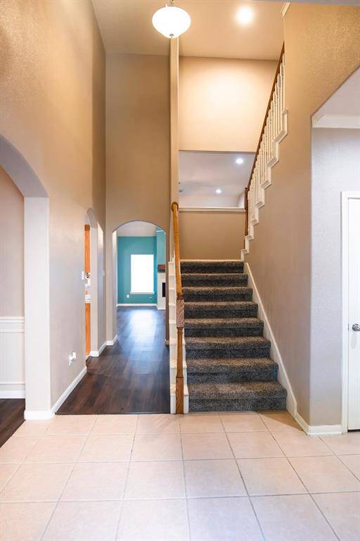 Grand two-story entrance greets you as you enter this large Move-in ready home.