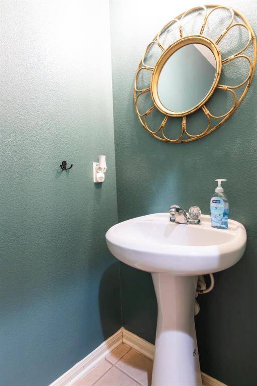 Half bath downstairs by large laundry room.