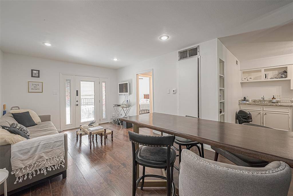 Another view of the dining and living areas. Entrance to the kitchen there to the right.
