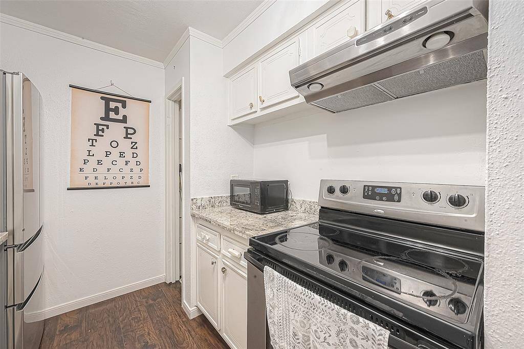 Handsome kitchen with granite countertops.