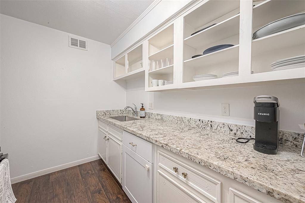Doorless cabinets allow for a more modern look. Plenty of counter space and storage.