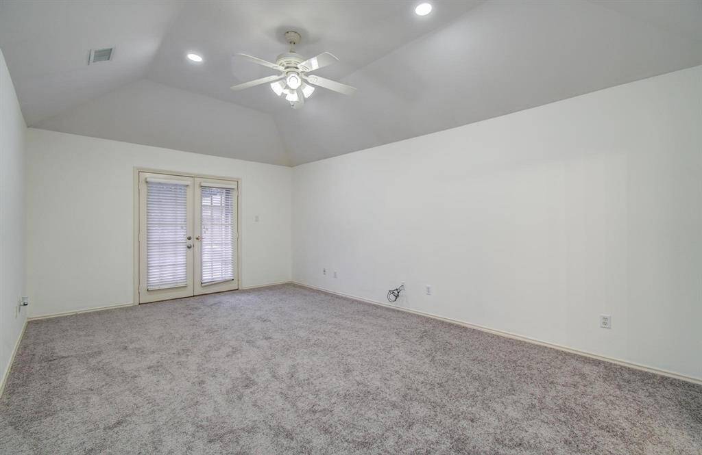Primary retreat with Vaulted ceiling, plush new carpet and private French-door access to the patio create a tranquil suite.