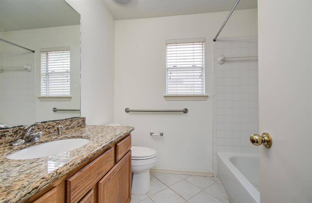 Updated hall bath, Granite-topped vanity, ceramic tile flooring and tub/shower combo with