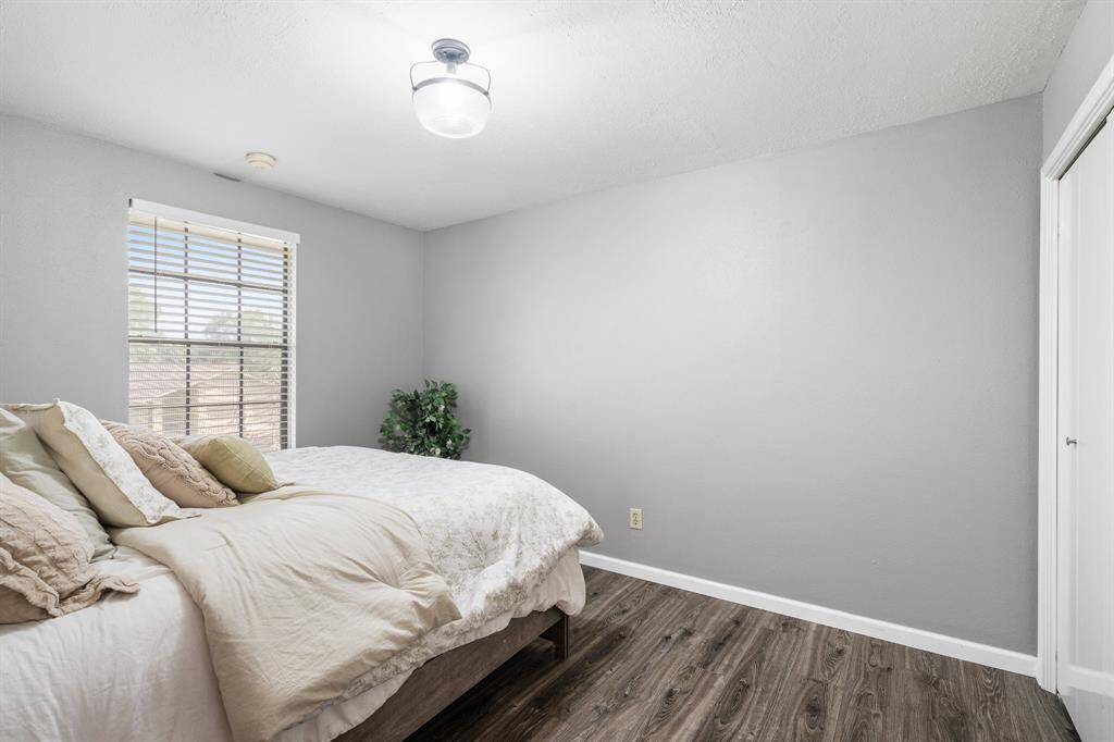 One of three bedrooms for guests or maybe a office.