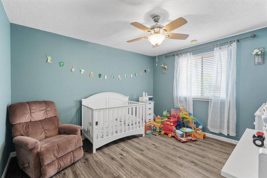 One of three bedrrooms being used for a childs sleeping area.