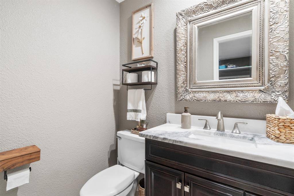Guest half bath near the utility room.