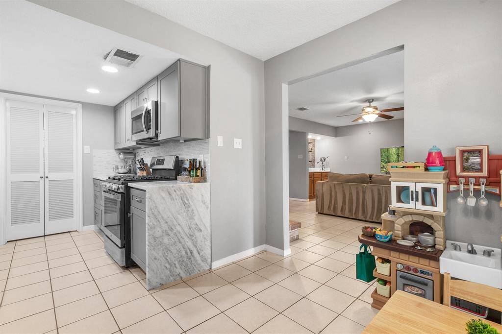 The breakfast area is currently being used a child's kitchen.