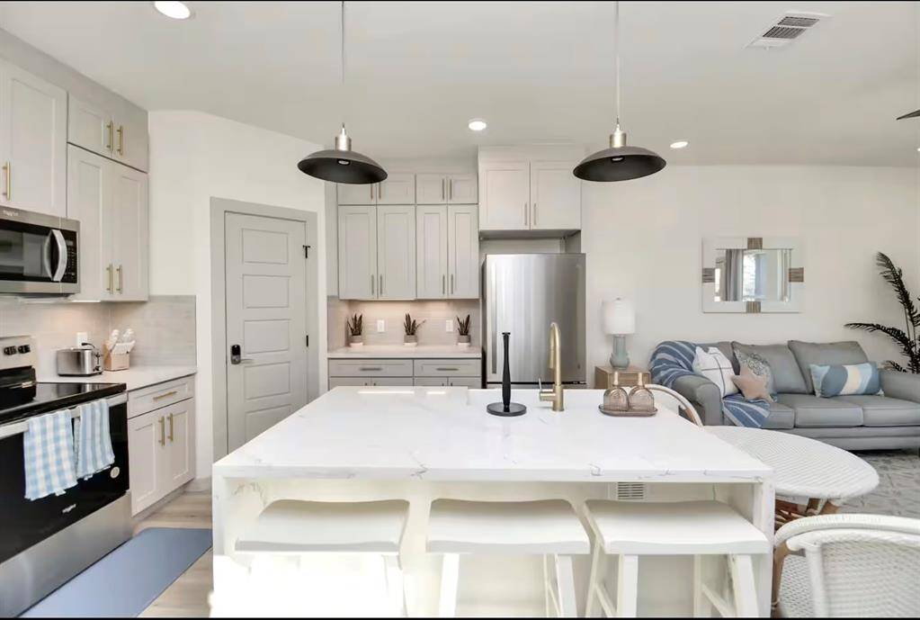 Enjoy a bar stool or the table and chairs in the kitchen seating area. comfortably seats 5.