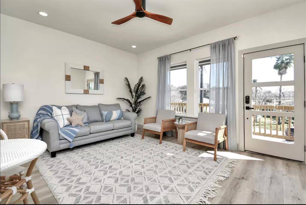 The large windows and glass door in the family room offers abundant natural lighting & brightness from sunny San Leon.