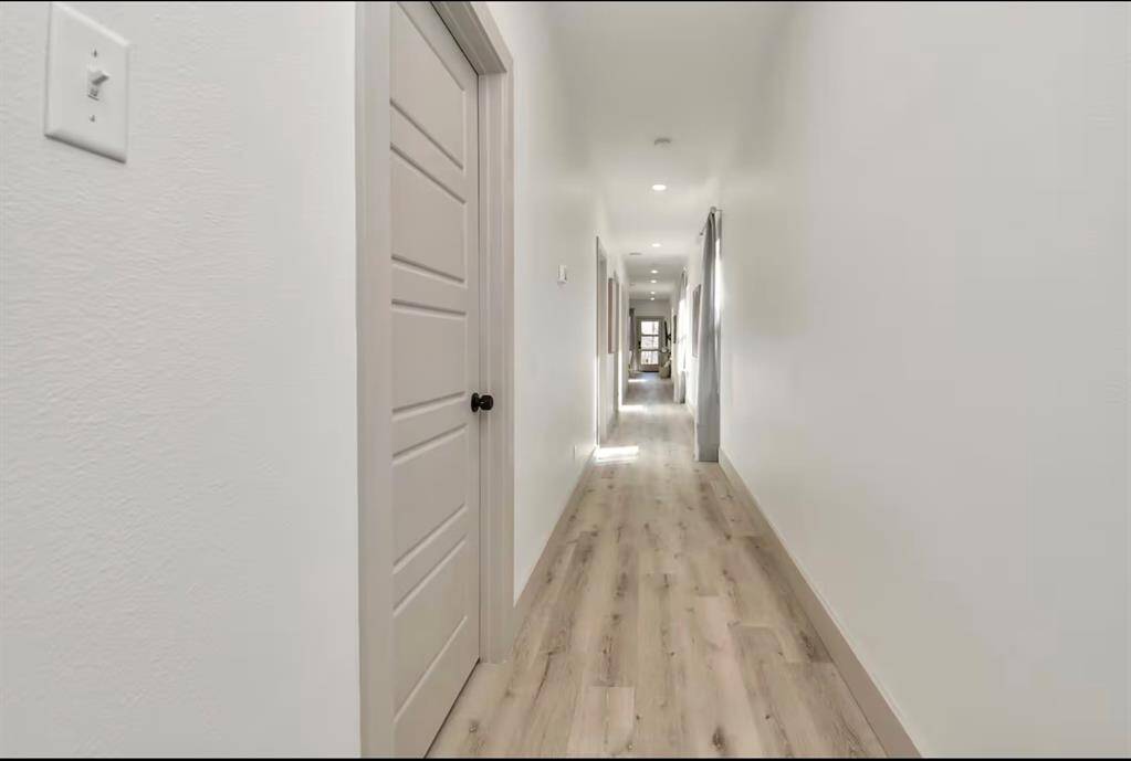 The long hallway through the house connects all the rooms together.