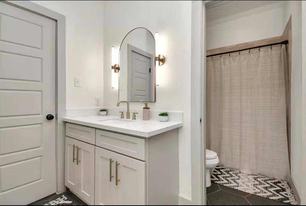 Guest bathroom is shared between Bedroom 2 & 3. Comes with vanity & shower/tub combo. Shampoo, conditioner, & body wash included.