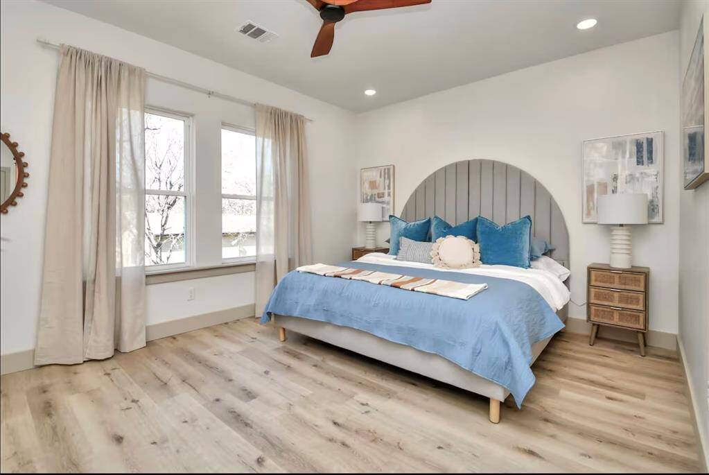 The spacious Primary Bedroom comes with a large King bed, Smart TV, en-suite restroom, and large walk-in closet.