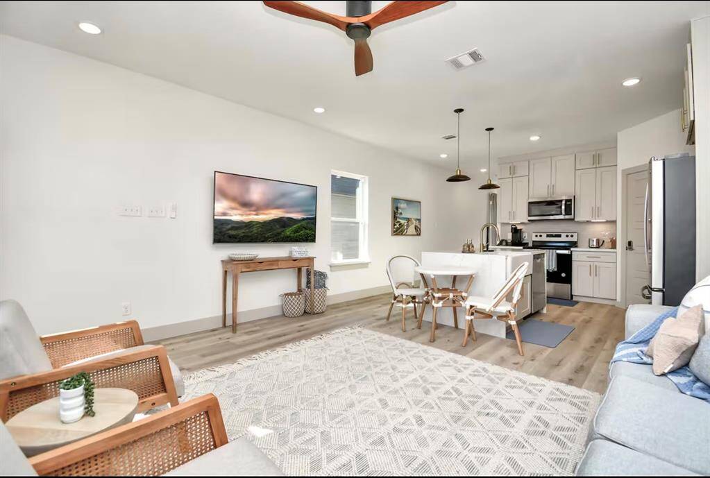 Natural lighting, comfortable seating, & a large Smart TV make this room the perfect place to watch your favorite game or show!