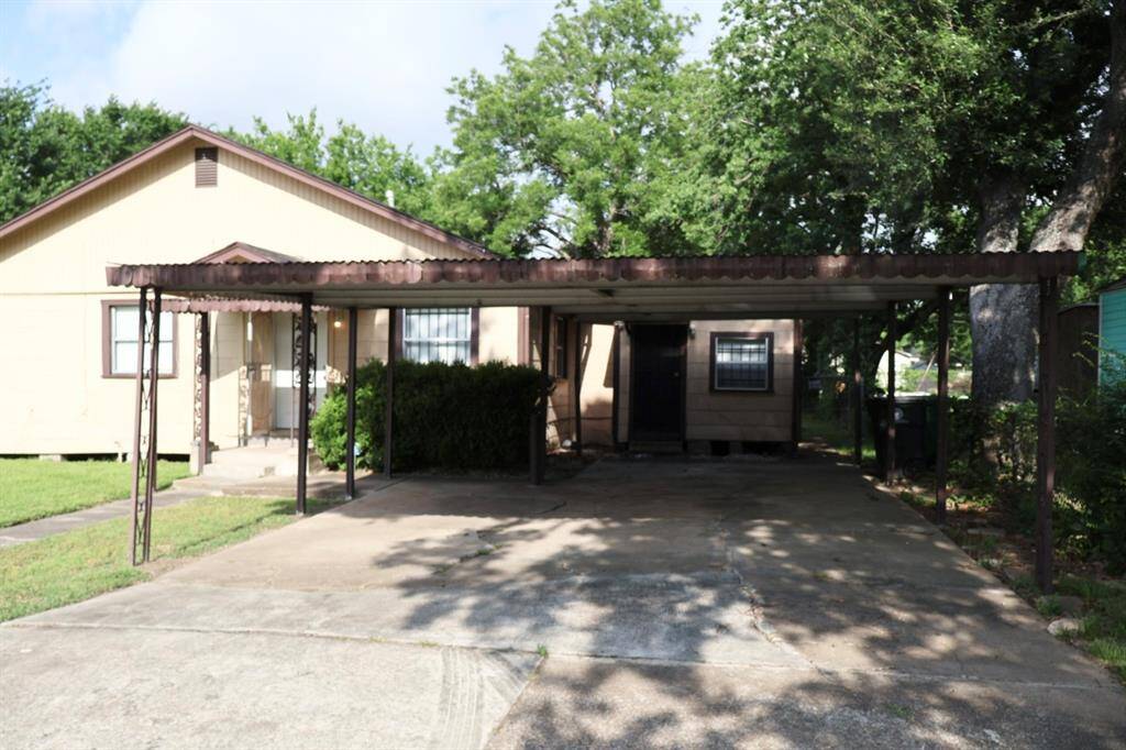Partial covered carport with ample parking.