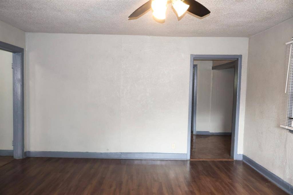 Living room with Ceiling fan.