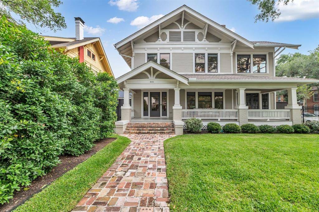 Welcoming entry offers an expansive 37 foot long covered front porch offering views of neighboring historic homes and the Live Oak tree lined street.