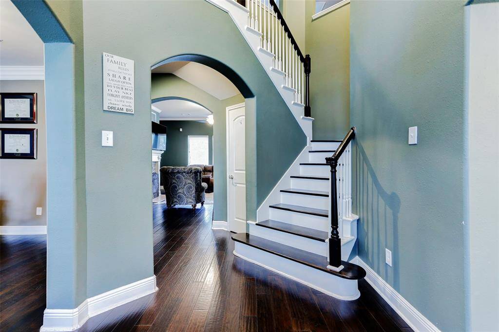 Beautiful 2-story foyers greets guest with an airy and open feel.