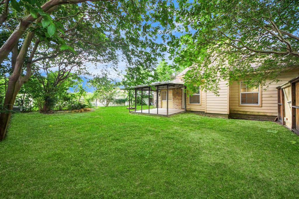 View of the fully fenced backyard