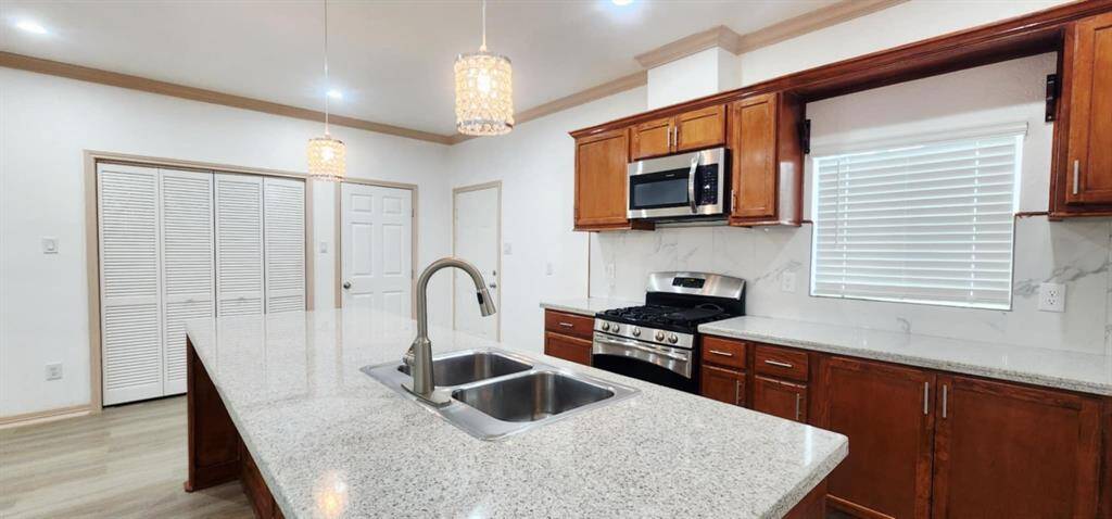 Spacious kitchen with new appliances.