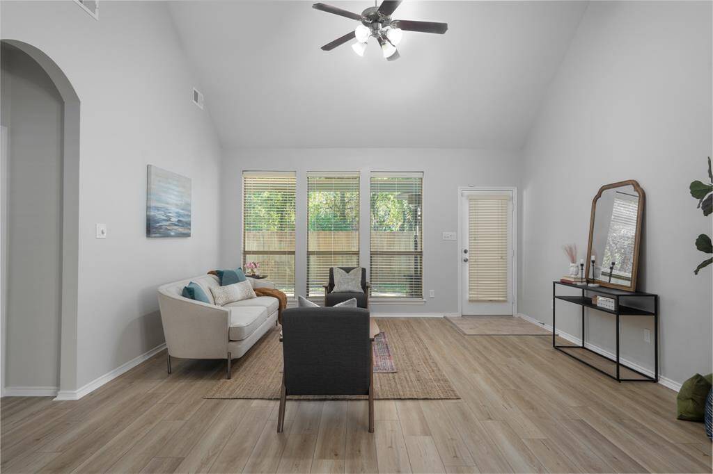 The gorgeous vinyl plank floors run continuously throughout the family room and dining room.