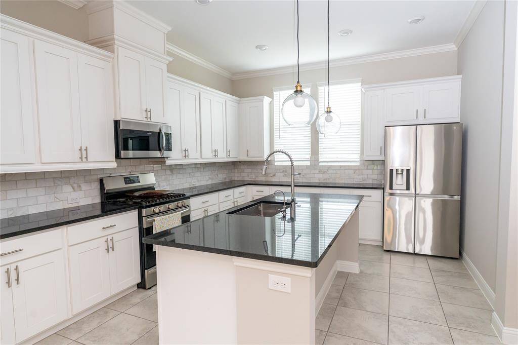 Modern white cabinets, stainless steel appliances