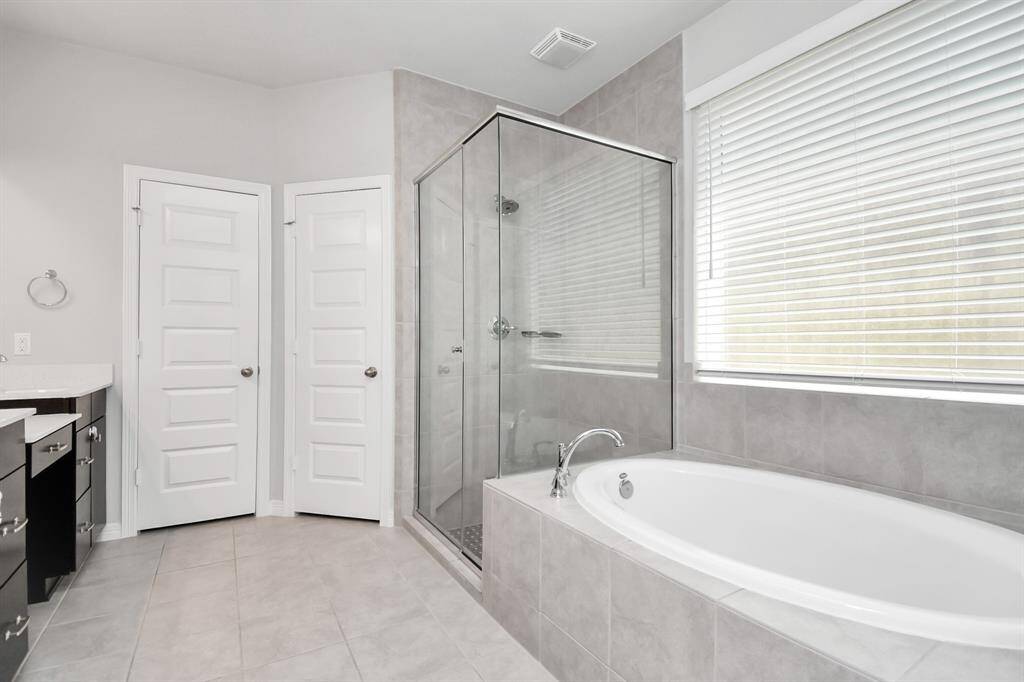 Indulge in the luxurious primary bathroom