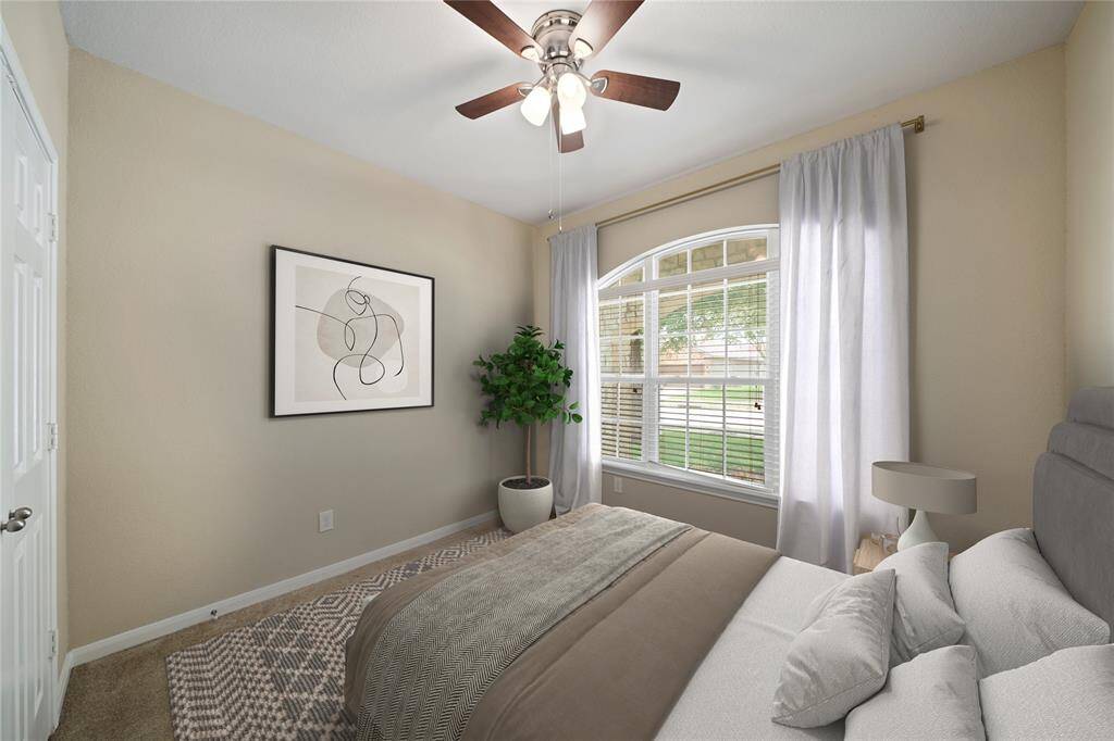 Third bedroom located on first floor at front of home