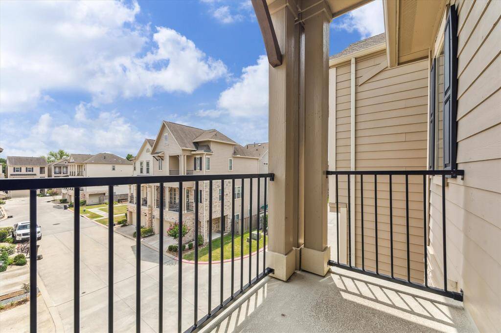 The balcony spanning the front of the home enjoys a restful view of the well-maintained community.   The HOA covers common area maintenance, gate management system, trash service and water/sewer.
