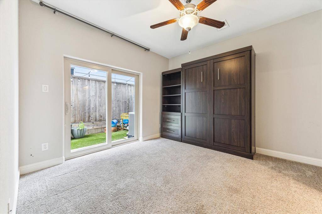 This first floor secondary bedroom with en-suite bath has access to the turfed backyard, which is perfect for pets, play, or even a garden area.