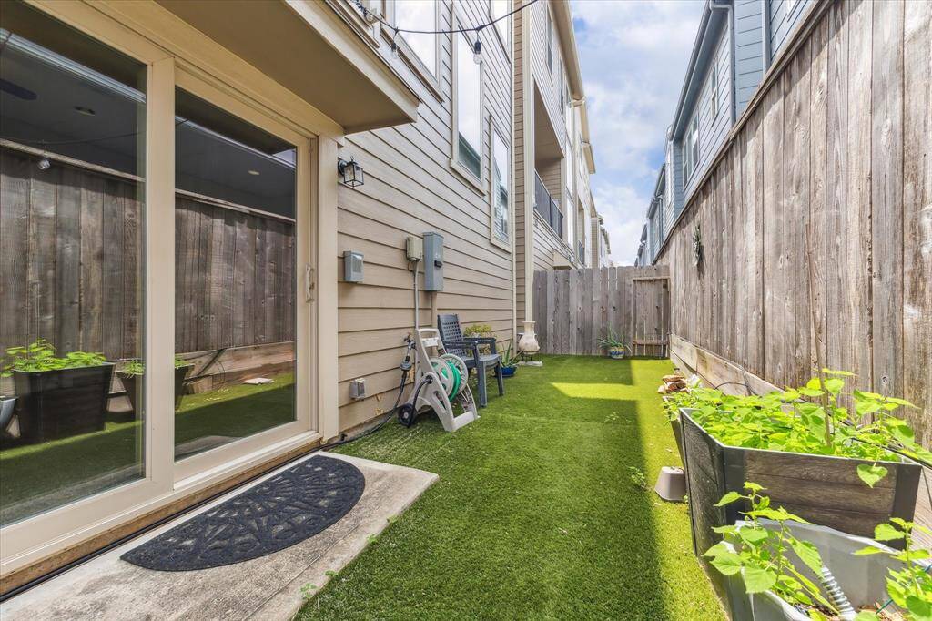 The low maintenance turfed backyard is perfect for people, pets and plants to enjoy.