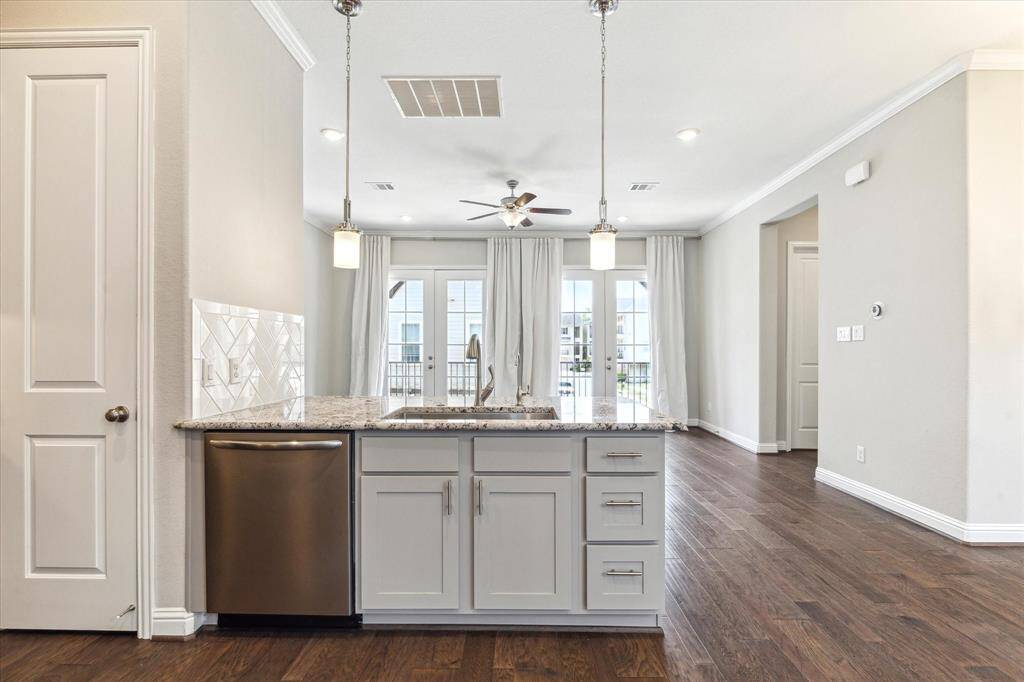 The kitchen opens to  the family room and overlooks the balcony across the front of the home.  The expansive peninsula offers great prep space and the breakfast bar on the opposite side is a great place for a casual meal.