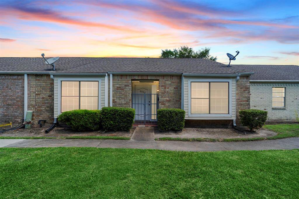 Welcome to 8952 Wilcrest Dr in Glenshannon community within Alief ISD. This stunning condo features a brick elevation with an ampel shared front yard.