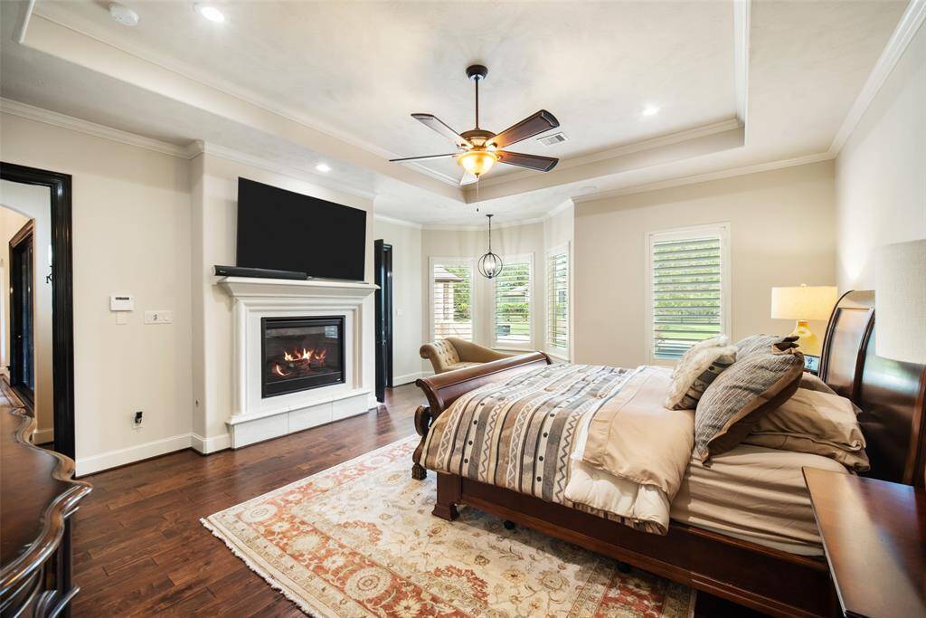 Relax in this primary suite with the warm & inviting fireplace.